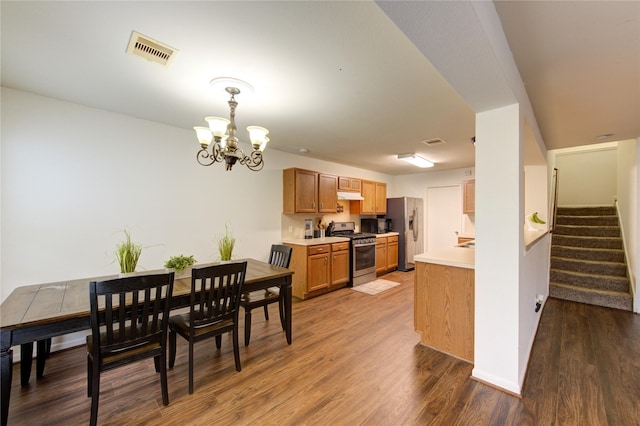 2910 Yearling Colt Ct, Houston, TX 77038 - dining room with a chandelier, wood finished floors, and stairway