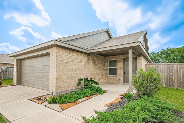 14627 Woodcott Warren Way, Pearland, TX 77545 - ranch-style house featuring an attached garage, brick siding, driveway, and roof with shingles