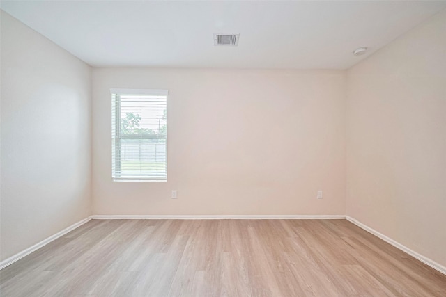 14627 Woodcott Warren Way, Pearland, TX 77545 - spare room featuring light wood finished floors, baseboards, and a smoke detector