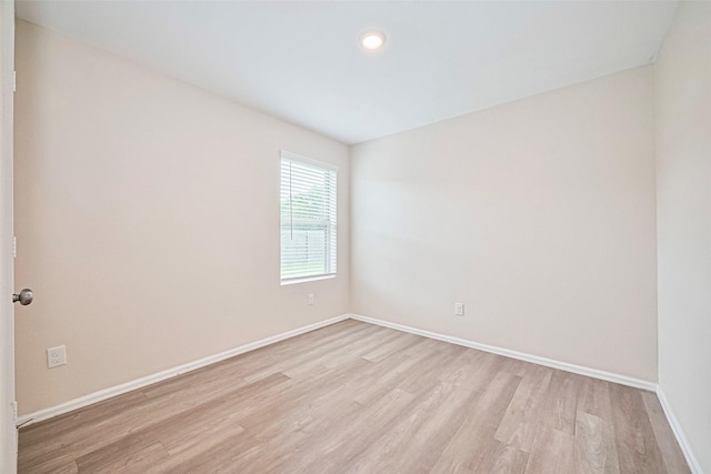 14627 Woodcott Warren Way, Pearland, TX 77545 - unfurnished room featuring light wood finished floors, baseboards, and recessed lighting