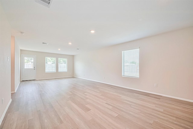 14627 Woodcott Warren Way, Pearland, TX 77545 - unfurnished room with light wood finished floors, baseboards, and recessed lighting
