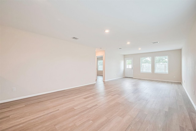 14627 Woodcott Warren Way, Pearland, TX 77545 - spare room featuring baseboards, light wood finished floors, and recessed lighting