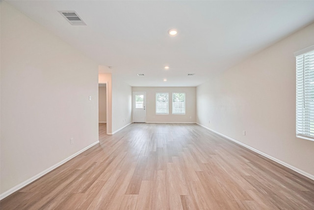 14627 Woodcott Warren Way, Pearland, TX 77545 - unfurnished room featuring baseboards, light wood-style flooring, and recessed lighting