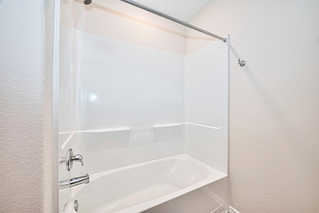 14627 Woodcott Warren Way, Pearland, TX 77545 - full bathroom with a textured wall and shower / tub combination