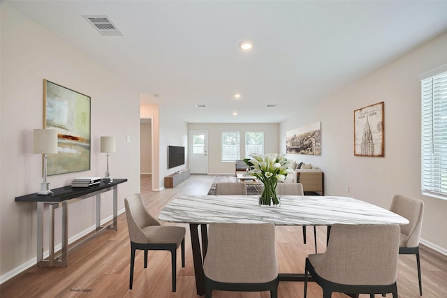 14627 Woodcott Warren Way, Pearland, TX 77545 - dining room featuring light wood-type flooring, baseboards, and recessed lighting