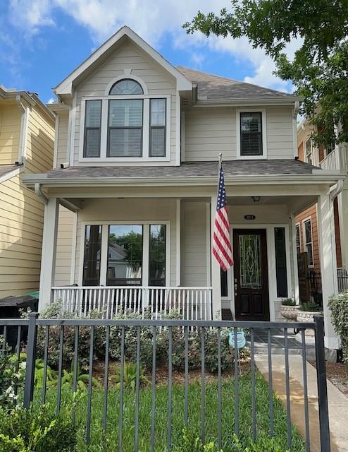 221 W 25th St Unit A, Houston, TX 77008 - view of front of property featuring a porch and roof with shingles
