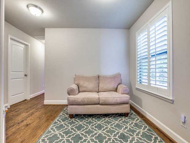 221 W 25th St Unit A, Houston, TX 77008 - sitting room with wood finished floors, plenty of natural light, and baseboards