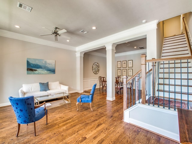 221 W 25th St Unit A, Houston, TX 77008 - living area with ornamental molding, ornate columns, a ceiling fan, stairs, and wood finished floors