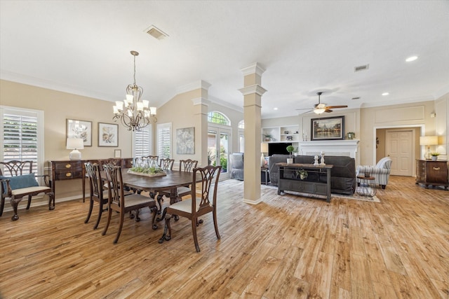 1902 Carriage Brook Way, Houston, TX 77062 - dining area with ornamental molding, healthy amount of natural light, light wood finished floors, a ceiling fan, and a fireplace