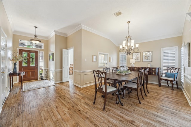 1902 Carriage Brook Way, Houston, TX 77062 - dining room featuring light wood-type flooring, a chandelier, wainscoting, and ornamental molding