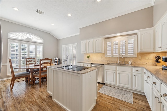1902 Carriage Brook Way, Houston, TX 77062 - kitchen with dishwasher, a sink, black electric cooktop, lofted ceiling, and a kitchen island