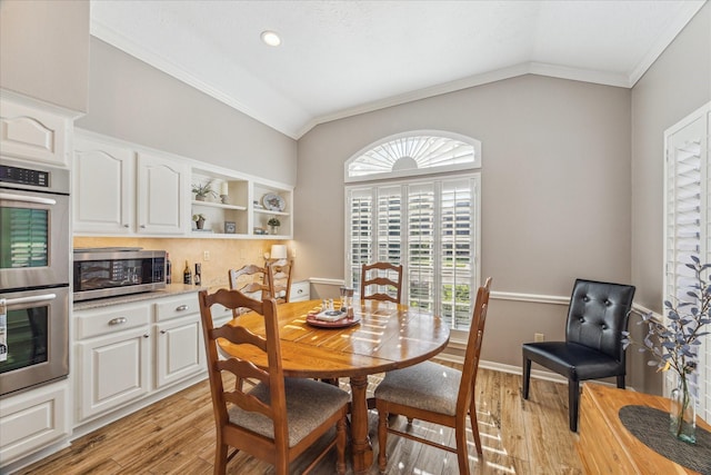 1902 Carriage Brook Way, Houston, TX 77062 - dining space featuring crown molding, lofted ceiling, and light wood-style flooring