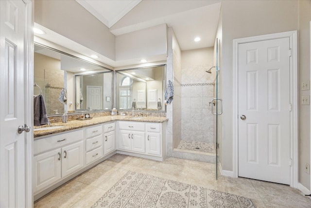 1902 Carriage Brook Way, Houston, TX 77062 - full bathroom featuring a stall shower, double vanity, tile patterned floors, and vaulted ceiling