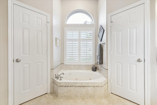 1902 Carriage Brook Way, Houston, TX 77062 - bathroom with a tub with jets and tile patterned flooring