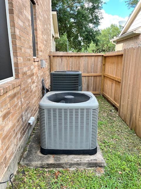 11608 Summer Moon Dr, Pearland, TX 77584 - exterior view of central AC unit and brick siding