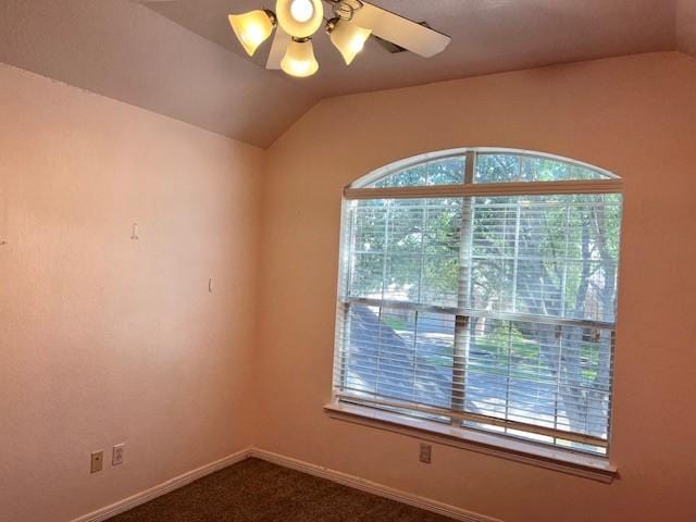 11608 Summer Moon Dr, Pearland, TX 77584 - spare room featuring vaulted ceiling, a ceiling fan, dark colored carpet, and baseboards
