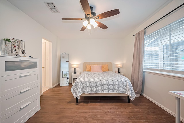 4304 Sherwood Ln Unit 106, Houston, TX 77092 - bedroom with wood finished floors, baseboards, and a ceiling fan