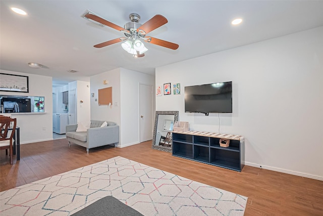 4304 Sherwood Ln Unit 106, Houston, TX 77092 - living room featuring wood finished floors, a ceiling fan, baseboards, and recessed lighting