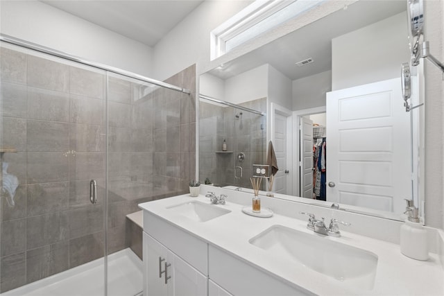 3125 Skyrock Dr, Houston, TX 77063 - full bathroom featuring a stall shower, double vanity, and a spacious closet