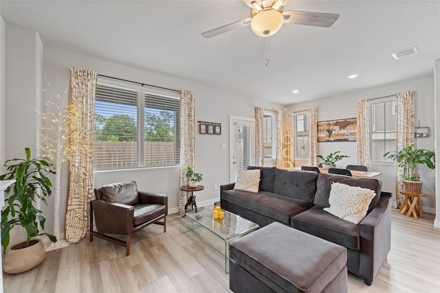 3125 Skyrock Dr, Houston, TX 77063 - living room featuring light wood-style flooring, ceiling fan, baseboards, and recessed lighting