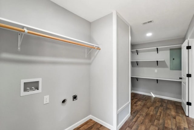 749 County Road 774, Buna, TX 77612 - washroom featuring hookup for an electric dryer, washer hookup, electric panel, wood finished floors, and baseboards