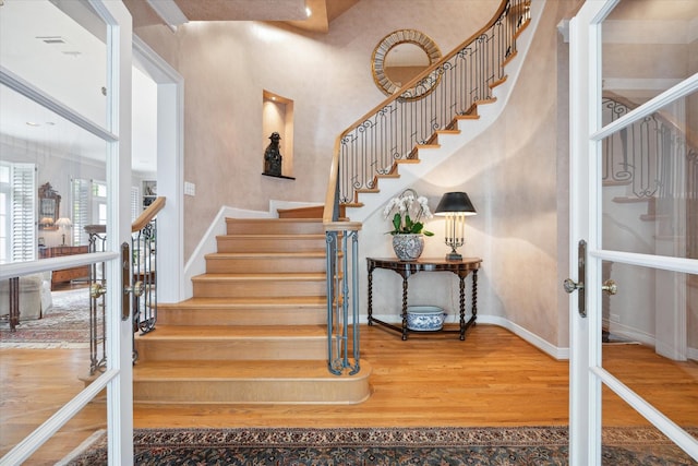 3633 Overbrook Ln, Houston, TX 77027 - staircase featuring wood finished floors and baseboards