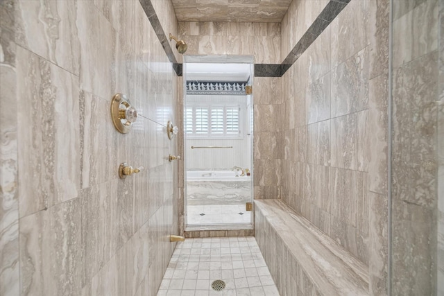 3633 Overbrook Ln, Houston, TX 77027 - bathroom with a garden tub, a tile shower, and tile patterned flooring