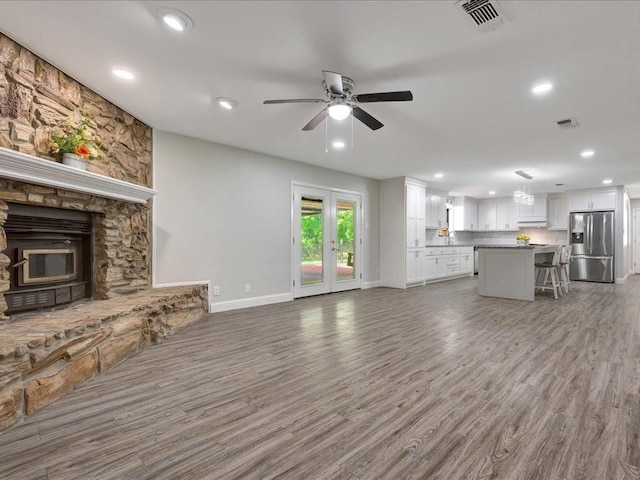 4449 Benton Rd, Lufkin, TX 75901 - unfurnished living room with ceiling fan, recessed lighting, baseboards, and wood finished floors