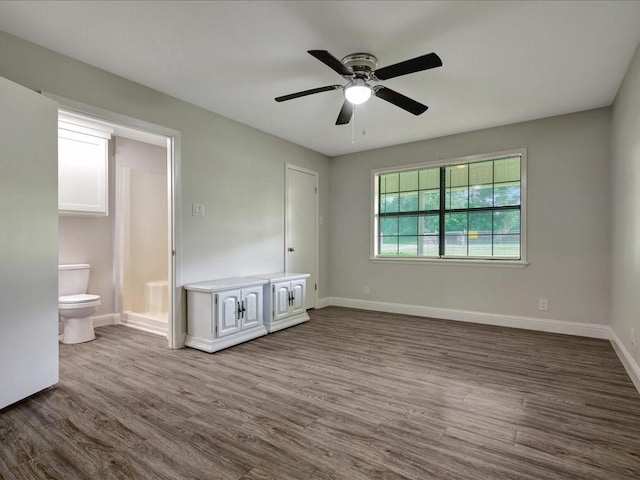 4449 Benton Rd, Lufkin, TX 75901 - unfurnished room featuring dark wood finished floors, baseboards, and ceiling fan