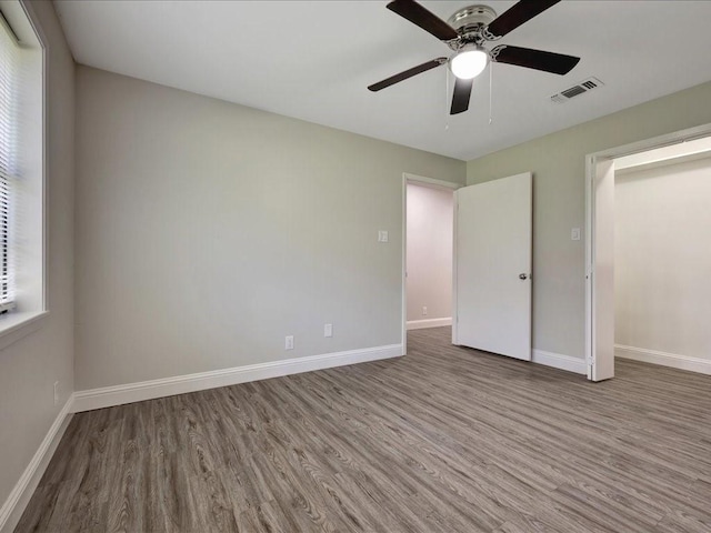 4449 Benton Rd, Lufkin, TX 75901 - unfurnished bedroom featuring wood finished floors, baseboards, and a ceiling fan