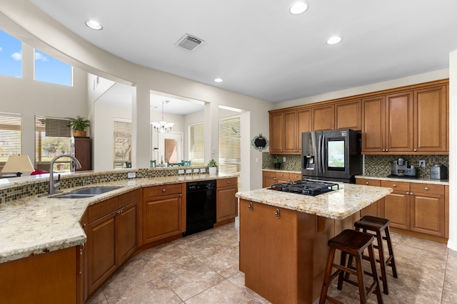 3610 Wellspring Lake Dr, Fulshear, TX 77441 - kitchen with stainless steel fridge with ice dispenser, dishwasher, a sink, gas cooktop, and decorative backsplash