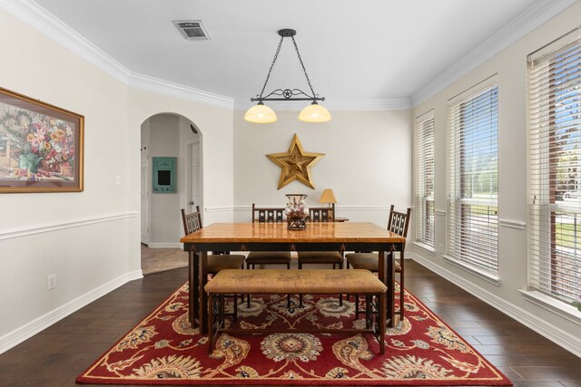 3610 Wellspring Lake Dr, Fulshear, TX 77441 - dining space with arched walkways, plenty of natural light, crown molding, dark wood-style flooring, and baseboards