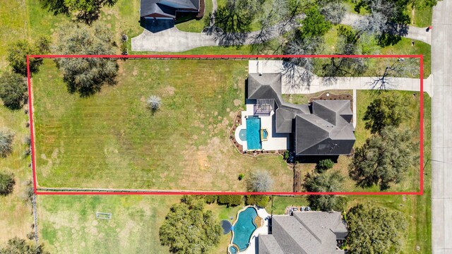 3610 Wellspring Lake Dr, Fulshear, TX 77441 - aerial view of property and surrounding area featuring a pool area and property boundaries highlighted
