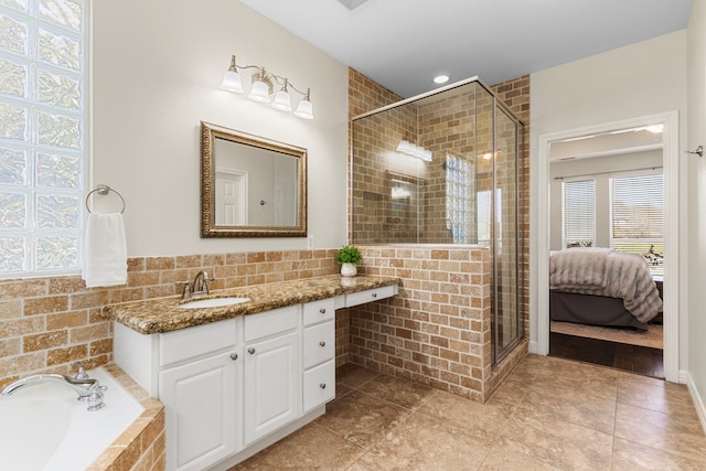 3610 Wellspring Lake Dr, Fulshear, TX 77441 - ensuite bathroom featuring a shower stall, a garden tub, and healthy amount of natural light