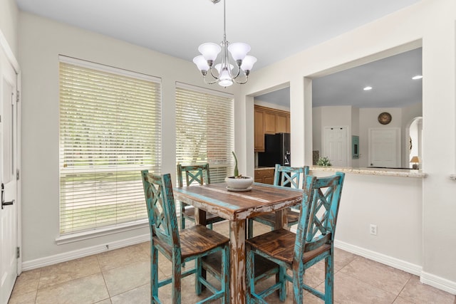3610 Wellspring Lake Dr, Fulshear, TX 77441 - dining area with a chandelier, baseboards, and light tile patterned flooring