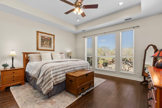 3610 Wellspring Lake Dr, Fulshear, TX 77441 - bedroom featuring a raised ceiling, dark wood finished floors, baseboards, recessed lighting, and a ceiling fan