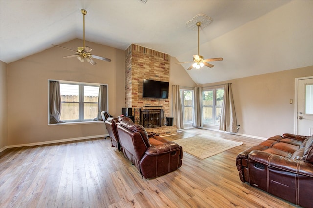 14927 Cypress Green Dr, Cypress, TX 77429 - living area featuring a ceiling fan, lofted ceiling, a fireplace, wood finished floors, and baseboards