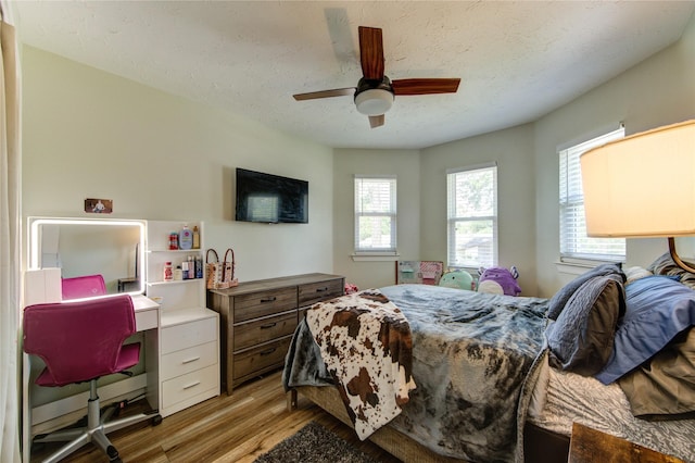 14927 Cypress Green Dr, Cypress, TX 77429 - bedroom with light wood-type flooring and a ceiling fan