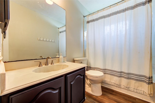 14927 Cypress Green Dr, Cypress, TX 77429 - full bathroom featuring toilet, vanity, wood finished floors, and curtained shower