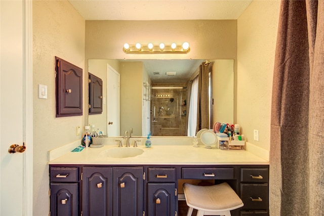 14927 Cypress Green Dr, Cypress, TX 77429 - full bathroom featuring a shower stall, vanity, and a textured wall