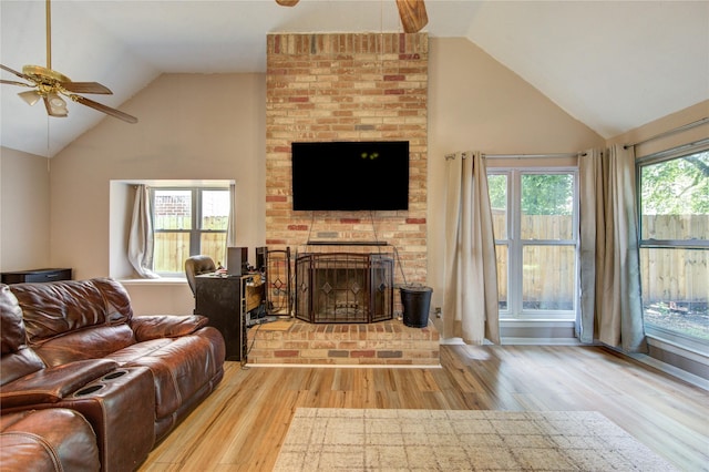 14927 Cypress Green Dr, Cypress, TX 77429 - living area with a ceiling fan, lofted ceiling, wood finished floors, and a brick fireplace