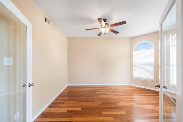 26 Oakmont Ct, Jersey Village, TX 77064 - unfurnished room with ceiling fan, french doors, light wood-style flooring, and baseboards