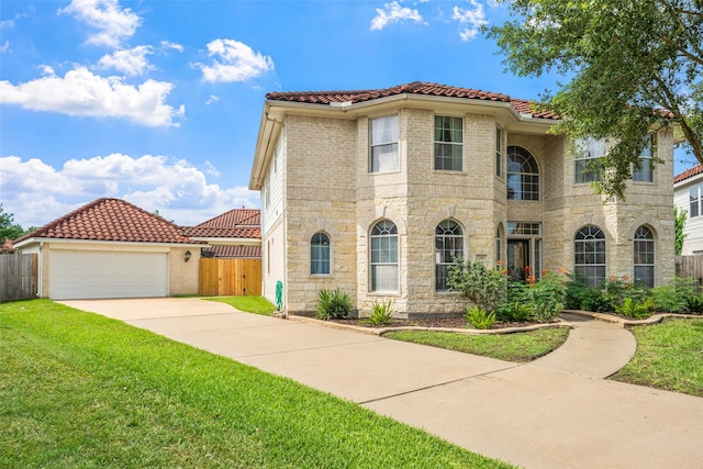 26 Oakmont Ct, Jersey Village, TX 77064 - view of front of home featuring driveway, a tiled roof, stone siding, and an attached garage