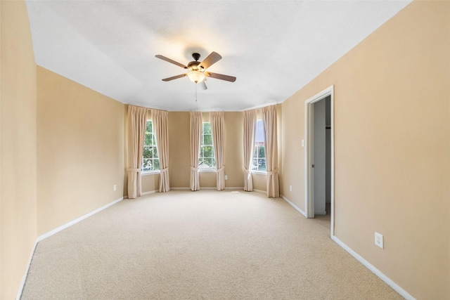 26 Oakmont Ct, Jersey Village, TX 77064 - empty room with a ceiling fan, light carpet, and baseboards