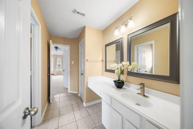 26 Oakmont Ct, Jersey Village, TX 77064 - bathroom featuring baseboards, tile patterned flooring, and vanity