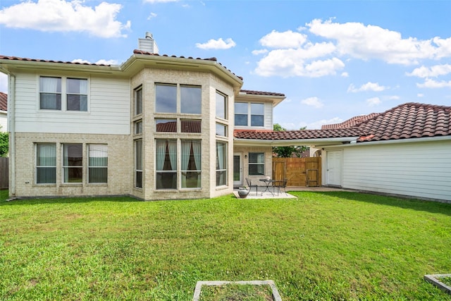 26 Oakmont Ct, Jersey Village, TX 77064 - rear view of property featuring a patio area, a chimney, a gate, and a tile roof