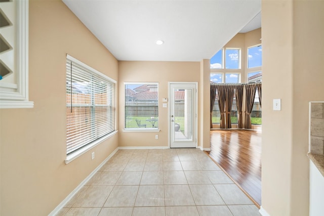 26 Oakmont Ct, Jersey Village, TX 77064 - entryway featuring healthy amount of natural light, baseboards, light tile patterned floors, and recessed lighting