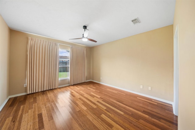26 Oakmont Ct, Jersey Village, TX 77064 - unfurnished room with wood finished floors, a ceiling fan, and baseboards