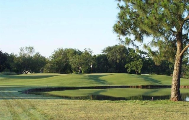 26 Oakmont Ct, Jersey Village, TX 77064 - surrounding community featuring golf course view, a lawn, and view of scattered trees