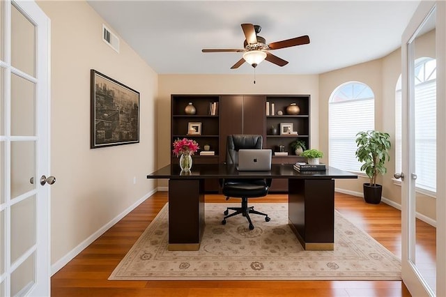 26 Oakmont Ct, Jersey Village, TX 77064 - office with a ceiling fan, wood finished floors, french doors, and baseboards